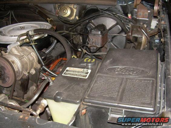 1984 Ford Bronco engine bay showing fuse box and Motorcraft label