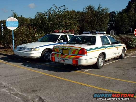 dscf0001.jpg Here are 2 of the vehicles. The one on the left is a 1997 Ex-NYPD Unit P71. The one on the right is a 2000 GCC Spec Crown Victoria operating as an Official Police Vehicle in the UK. GCC Spec Crown Victorias are identified by a P72 in their VIN. They come standard with dual exhaust, Town Car seats (w/ rear AC vents), LX Wheels, Metric Speedometer, Black rear fascia, Arabic text on the right wing mirror as well as an Arabic copy of the Owner's Manual (in addition to the English copy). 