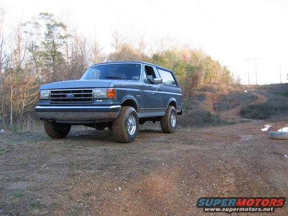Gray 1989 Ford Bronco parked on a dirt road