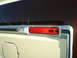 1979 Ford Bronco - Detail of a vehicle's rear marker light assembly with chrome trim.