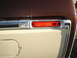 1979 Ford Bronco - This photo shows the rear corner of a vehicle with a red reflector and chrome trim, along with a fuel door.