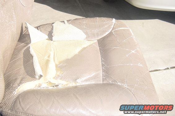 The seat bottom panel is badly torn.