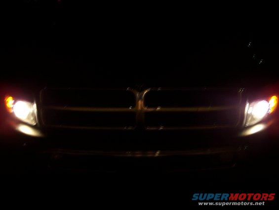 Front grille and headlights of a 2001 Dodge 1500 at night