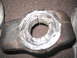 1991 Ford Bronco - A metal component, possibly a differential housing, with a machined opening and partial numerical inscription.