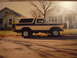 1977 Ford F-150 - This two-tone beige and brown 1978 Ford Bronco is parked on a residential street.