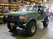 1989 Ford Bronco - This lifted 1989 Ford Bronco features aggressive off-road tires and a prominent winch on the front bumper.