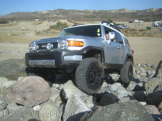 Silver Toyota FJ Cruiser navigating rocky terrain