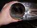1991 Ford Bronco - A hand holds a chrome exhaust pipe, revealing its internal structure and baffles.