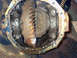 1989 Ford Bronco - A greasy differential part, likely from a Ford Bronco, is shown in this close-up view.