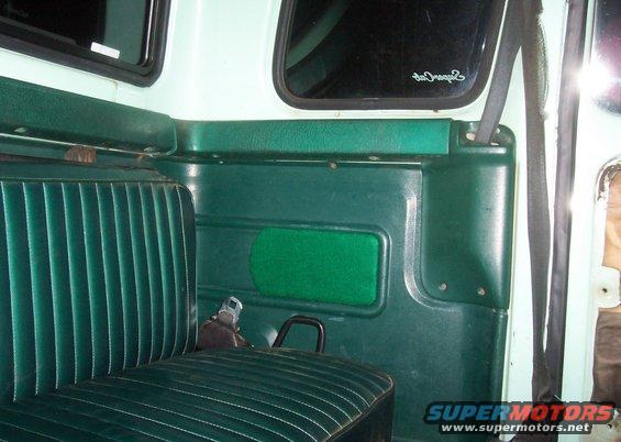 Green bench seat and door panel interior of a truck