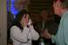 1966 Ford Bronco - A woman is emotional while friends celebrate with her at a party.