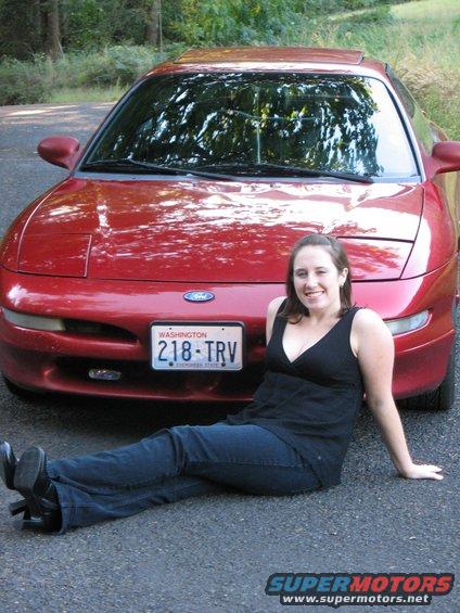 Red 1997 Ford Probe front view with woman sitting in front