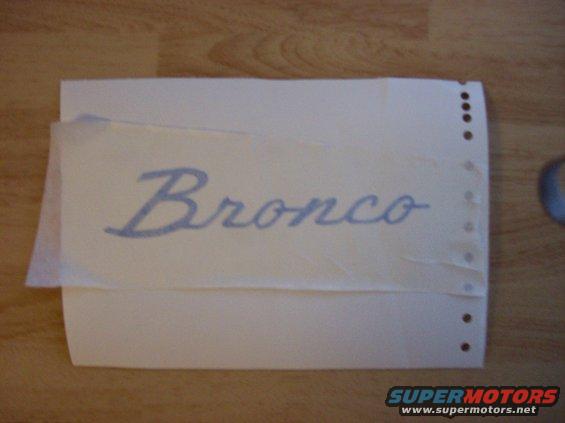 Decal with "Bronco" text in blue script on white paper