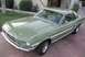 1978 Ford Mustang II - This green coupe features distinctive white side stripes and a classic design.