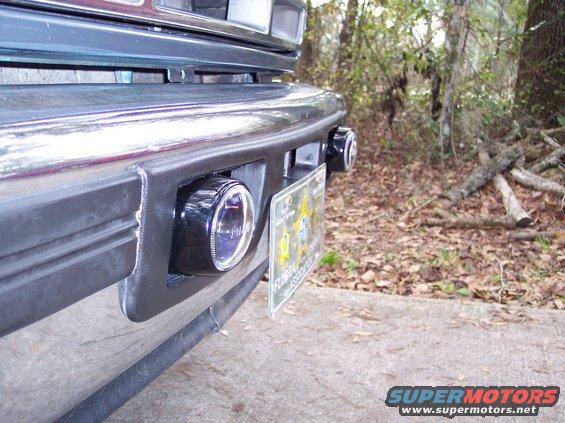 108_0746.jpg These are the fog lights that I got from my daughter for X-mas. I wasn't sure that I would like them at first. I tried mounting them under the bumper (there were holes for lights already drilled in the underside of the bumper, but they weren't evenly spaced) but they hung too low for my taste, so I tried sticking them in the bumper cutouts and viola! They all held in place with industrial-strength sticky-back velcro (they're also zip-tied to the bumper mounts in case they get knocked loose)