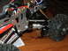 1996 Ford Bronco - Close-up of an RC car's chassis, showing suspension, motor, and wiring details.
