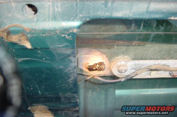 Another picture of the break, with a flashlight highlighting the connector,