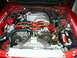 1990 Ford Mustang - The engine bay features an MSD ignition system with red spark plug wires and a red distributor cap.