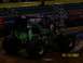 1993 Ford Bronco - The iconic Grave Digger monster truck is seen here in a stadium setting.
