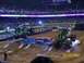 1993 Ford Bronco - Monster trucks perform stunts in an arena, crushing cars as part of the show.