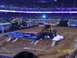 1993 Ford Bronco - Monster trucks compete in an arena, crushing cars as part of the event.