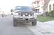 2004 Ford F-250 - This 2004 Ford F-250 truck is shown from the front, its distinctive chrome grille and fog lights.