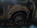 1978 Ford Bronco - Close-up view of a transmission component, showing signs of rust and wear.