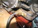 1978 Ford Bronco - A close-up view of a transmission component with a cable and fluid leakage.
