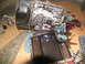 1978 Ford Bronco - Transmission pan removed, revealing internal components and accumulated grime from used transmission fluid.
