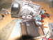 1978 Ford Bronco - Automatic transmission pan removed, showing dirty fluid and internal parts during a tear-down.