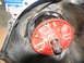 1978 Ford Bronco - Close-up of a transmission torque converter housing with a red pump assembly. A box with 'HAMMERMILL' is visible in the background.