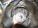1978 Ford Bronco - A transmission clutch pack is held within the bell housing during a tear-down.