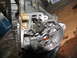 1978 Ford Bronco - Internal view of a disassembled transmission, showing gears and linkages with traces of red fluid.