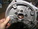 1978 Ford Bronco - A close-up view of a transmission component, showing internal workings and fasteners.