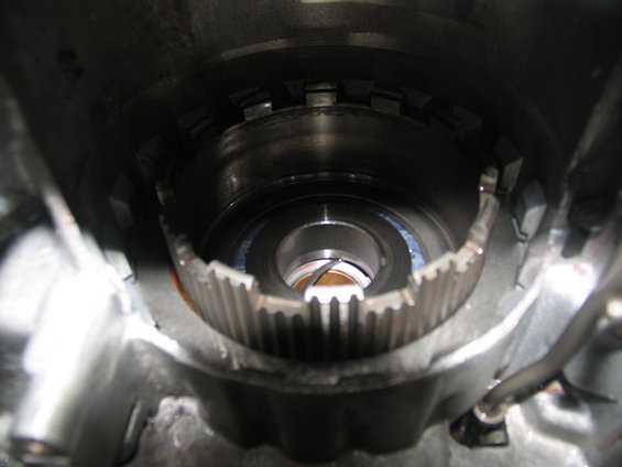 Close-up of internal transmission components, showing gears and a bearing