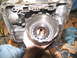 1978 Ford Bronco - Removing the transmission drum assembly during a tear-down process. Tools are laid out nearby.
