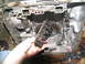 1978 Ford Bronco - A person holds a disassembled transmission valve body, showing numerous small springs.