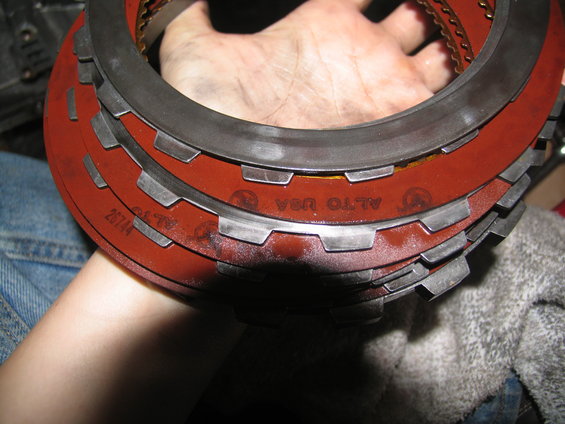 Stack of Alto USA transmission clutch plates with part number 25744 visible