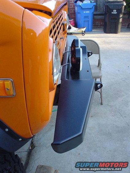Orange 1977 Ford Bronco front bumper and headlight with aftermarket lights