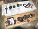 1978 Ford Bronco - Disassembled transmission components are arranged on cardboard for inspection or repair.