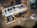 1978 Ford Bronco - Various components of an automatic transmission are disassembled and spread out on the floor for inspection or repair.