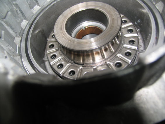 Close-up of a metal bearing assembly inside a transmission housing