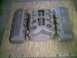 1964 Ford 427 - Ford valve covers and intake manifold parts laid out on a wooden surface.