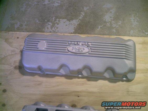 Silver Ford valve cover with '427' and Ford oval logo embossed on top