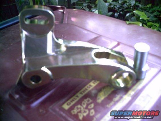 chrome-plated metal bracket with holes and a pin