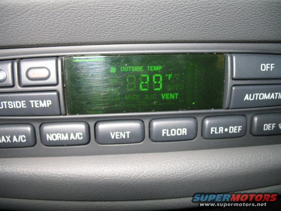 Climate control panel with digital display showing 29F outside temperature and buttons for MAX A/C, NORM A/C, VENT, FLOOR, FLR DEF, DEF, OFF, and AUTOMATIC