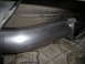 1997 Ford F-250 - A new exhaust pipe section is installed on the underside of a vehicle, connecting to existing components.