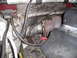 1997 Ford F-250 - Close-up view of the engine bay, focusing on the turbocharger and associated piping. Some heat shielding is visible.