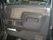 1988 Ford Bronco - Interior door panel detail showing fabric insert, storage pocket, and a small aftermarket switch panel.
