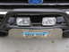 1990 Ford Bronco - Front view of a 1990 Ford Bronco, showing the bumper, winch, and auxiliary lights.